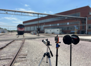 Train on train tracks near recording equipment