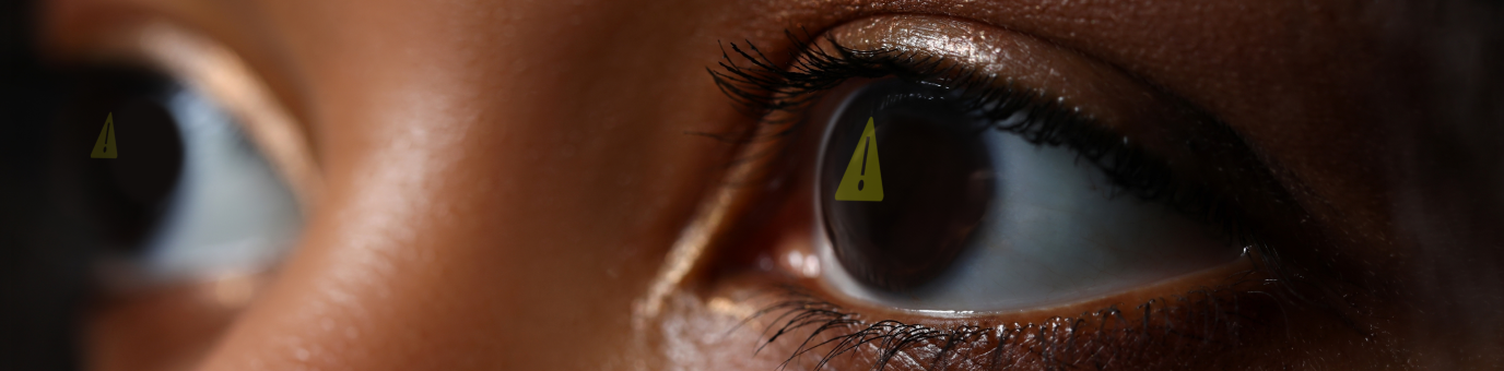 Warning signs reflected in eyes, AI